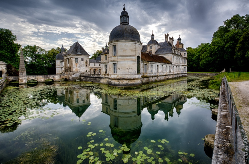 Château de Tanlay reflects off of the moat.